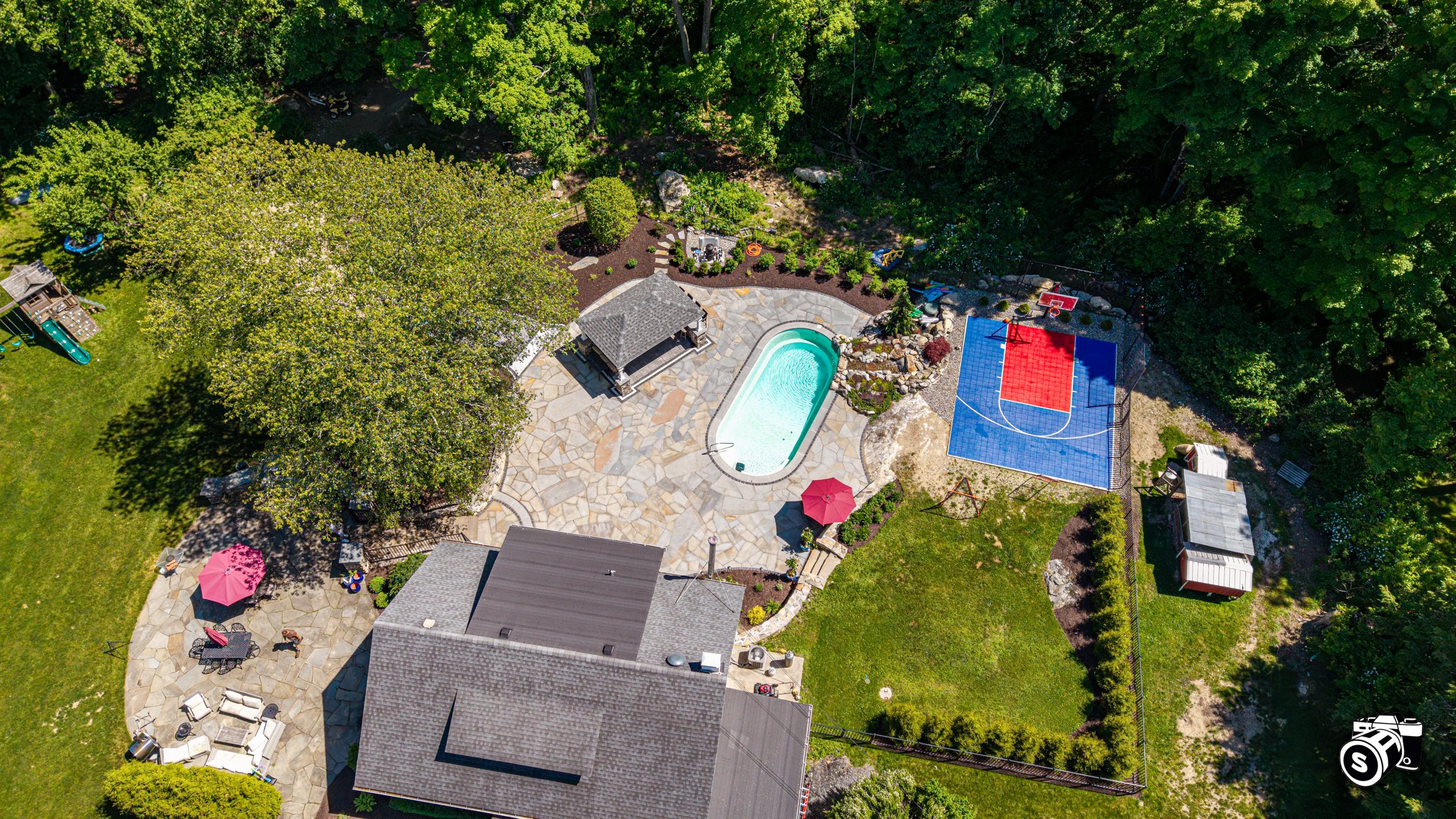 Backyard with in-ground pool, sport court and patio