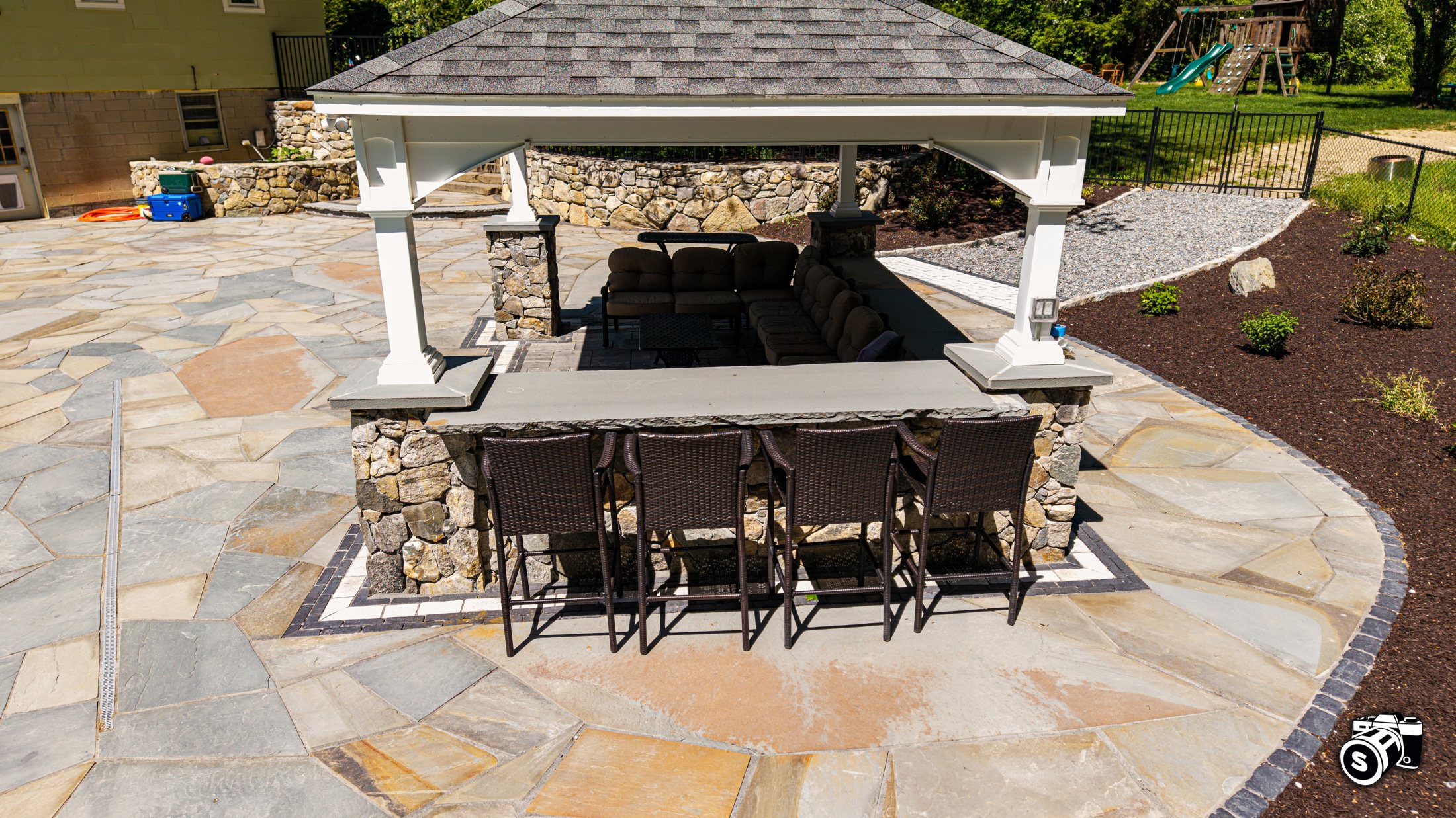 Aerial of a covered outdoor kitchen and bar