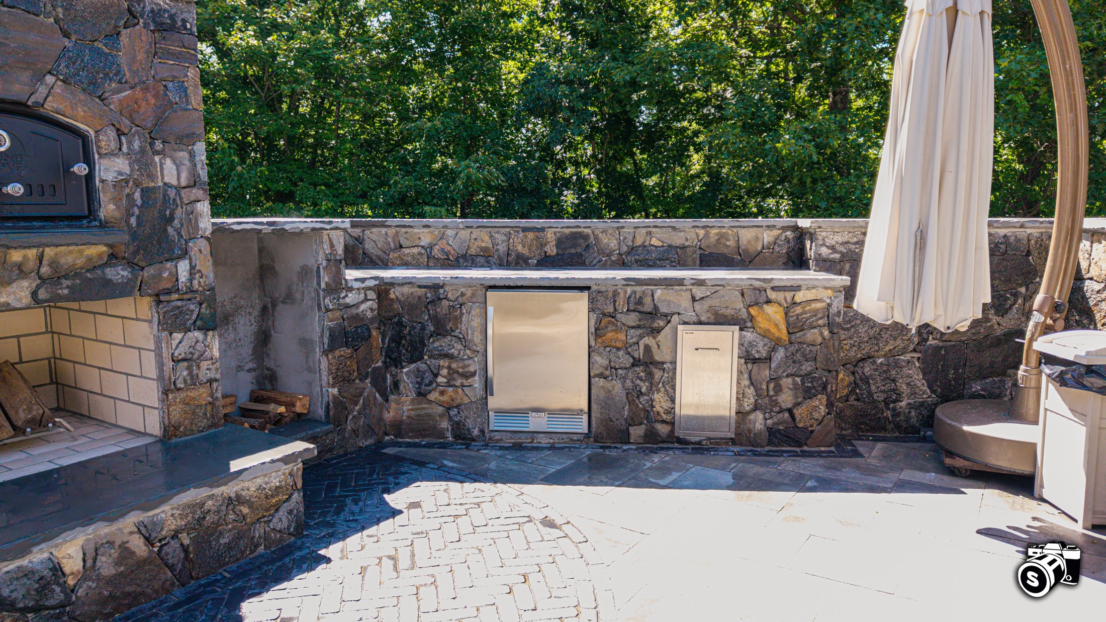 Stone patio with built-in fire feature