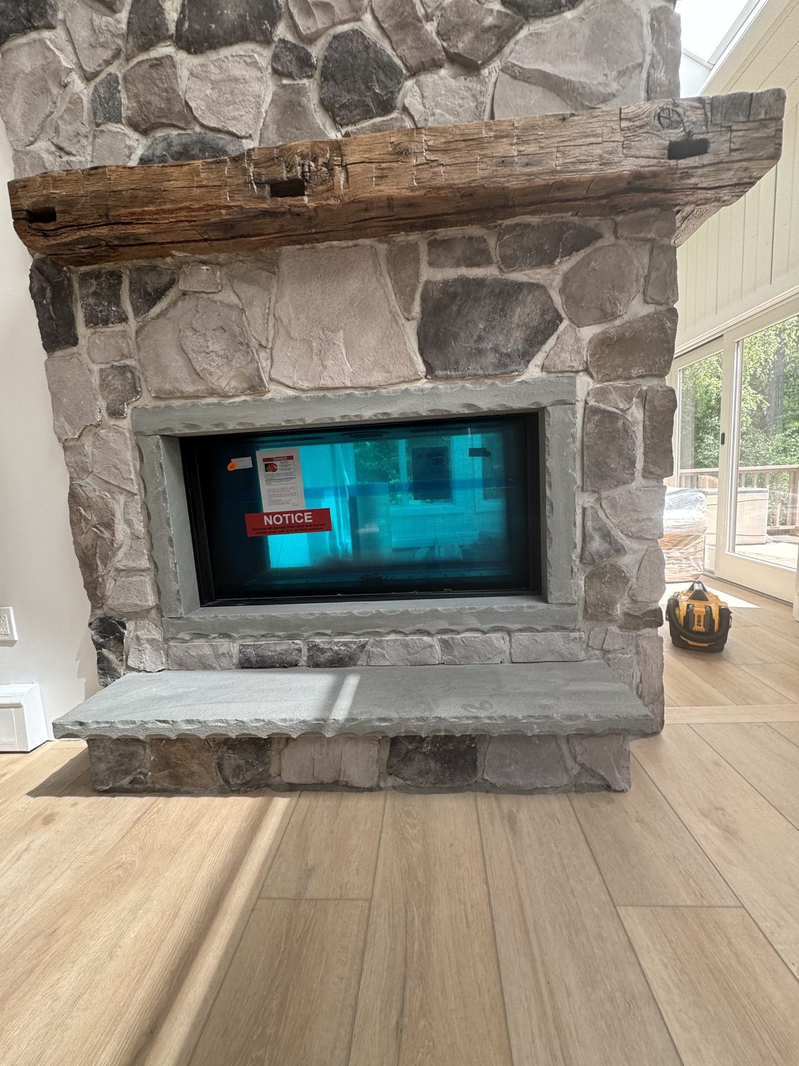 Reclaimed wood beam fireplace mantel