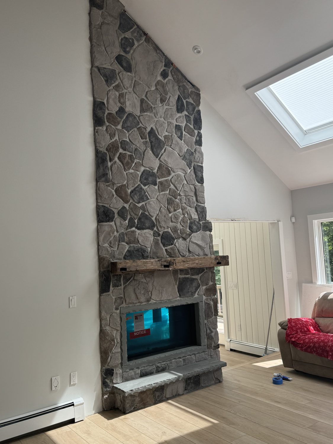 Floor-to-ceiling stone outdoor fireplace