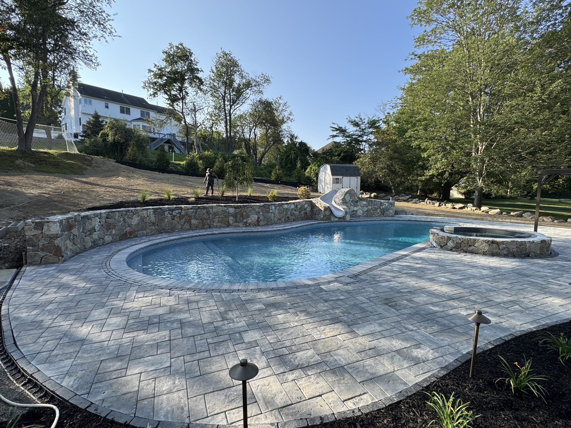 Paver pool deck with spa
