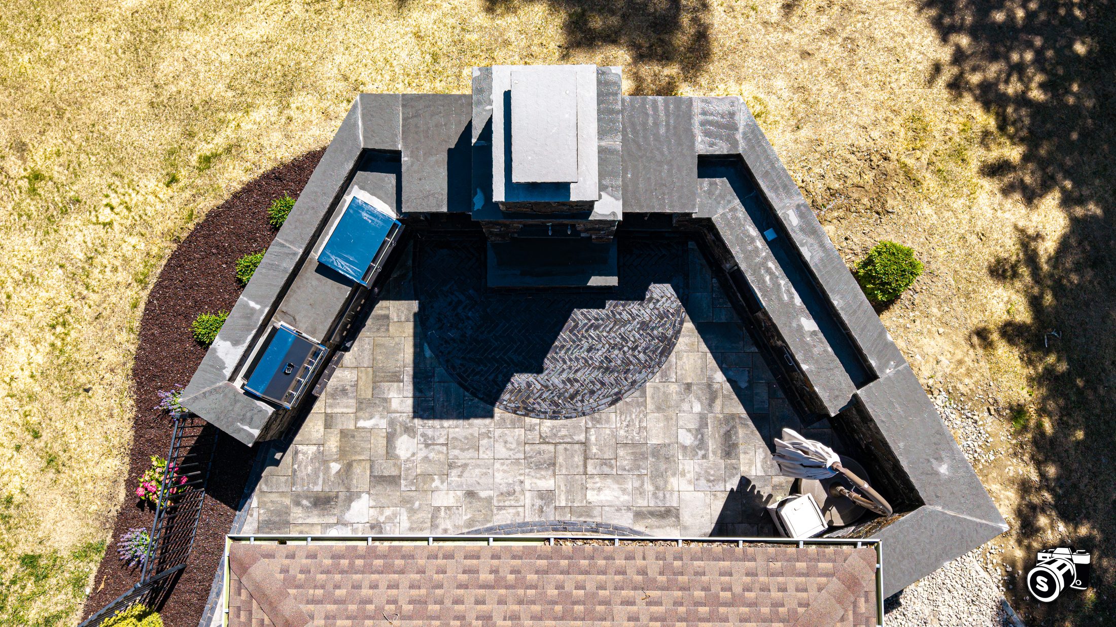 Aerial of an in-ground pool and patio