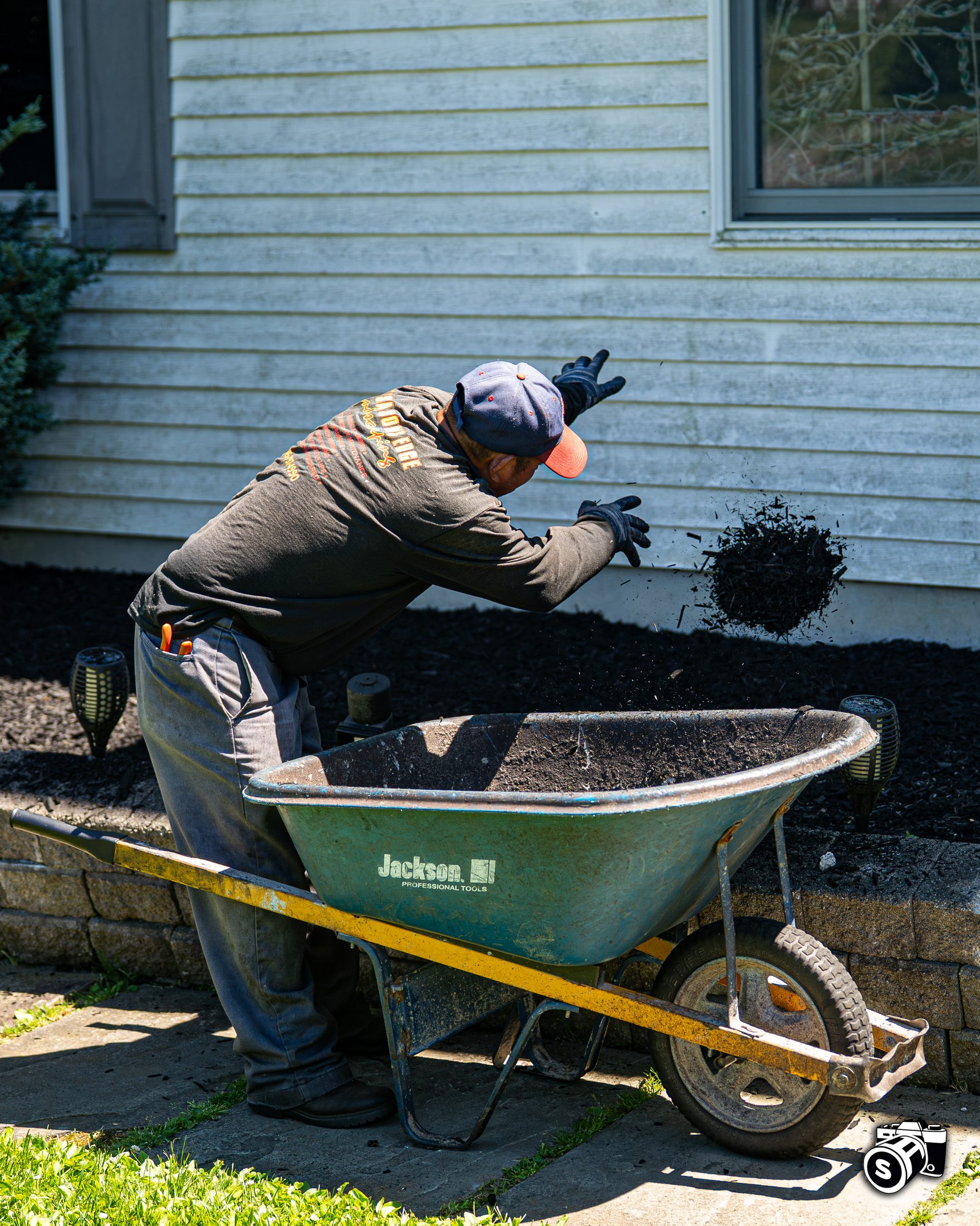 Crew installing mulch and garden beds
