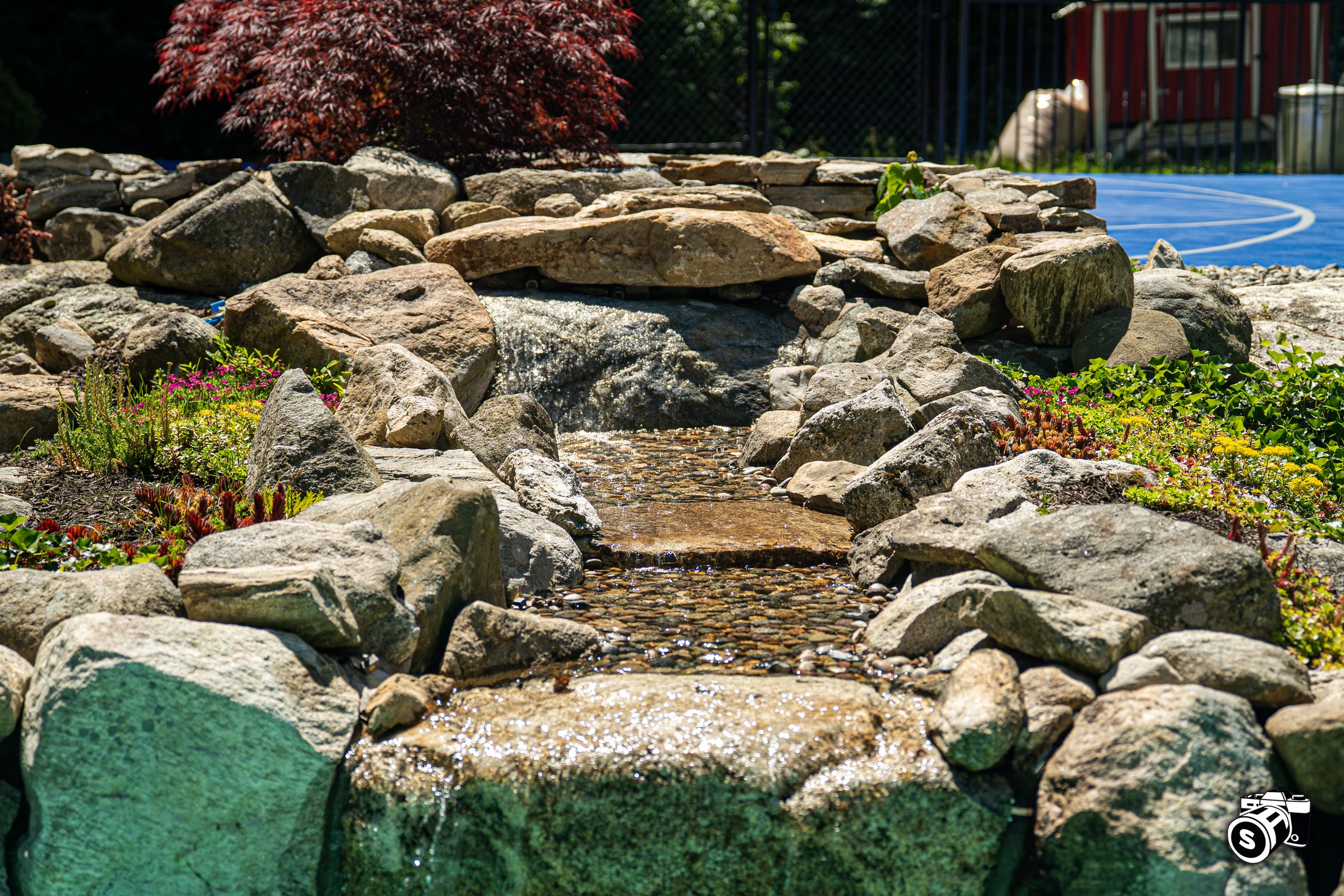Natural boulder water stream feature